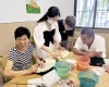 “扇语康心”志愿队赴吴门扇艺工坊开展非遗助残专项实践